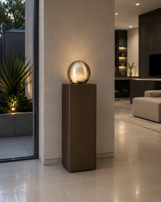 Self-Contained Metal Orb Fountain with River Stones
